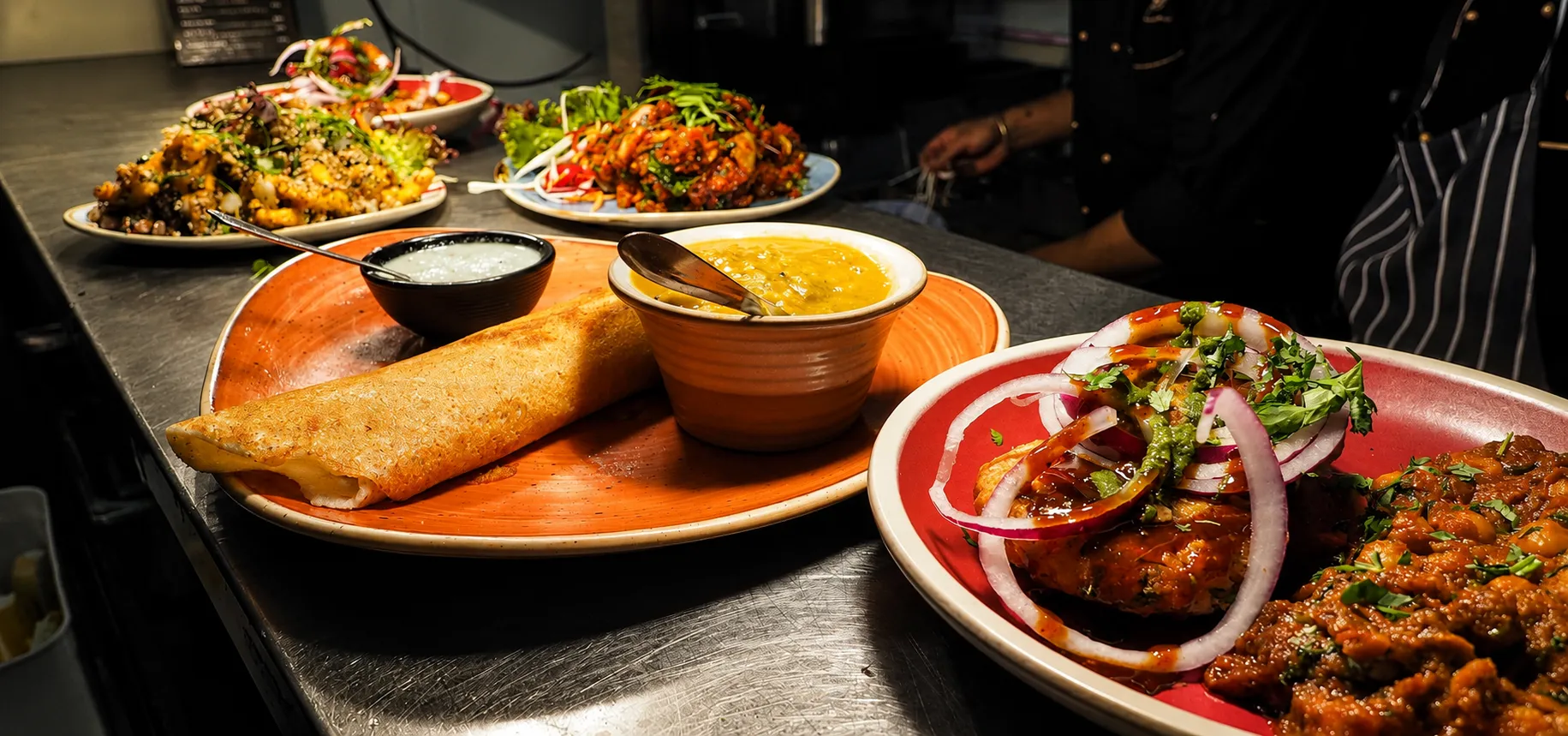 Indian Curry House-Banff dining table with authentic Indian curry dishes in Banff, Alberta